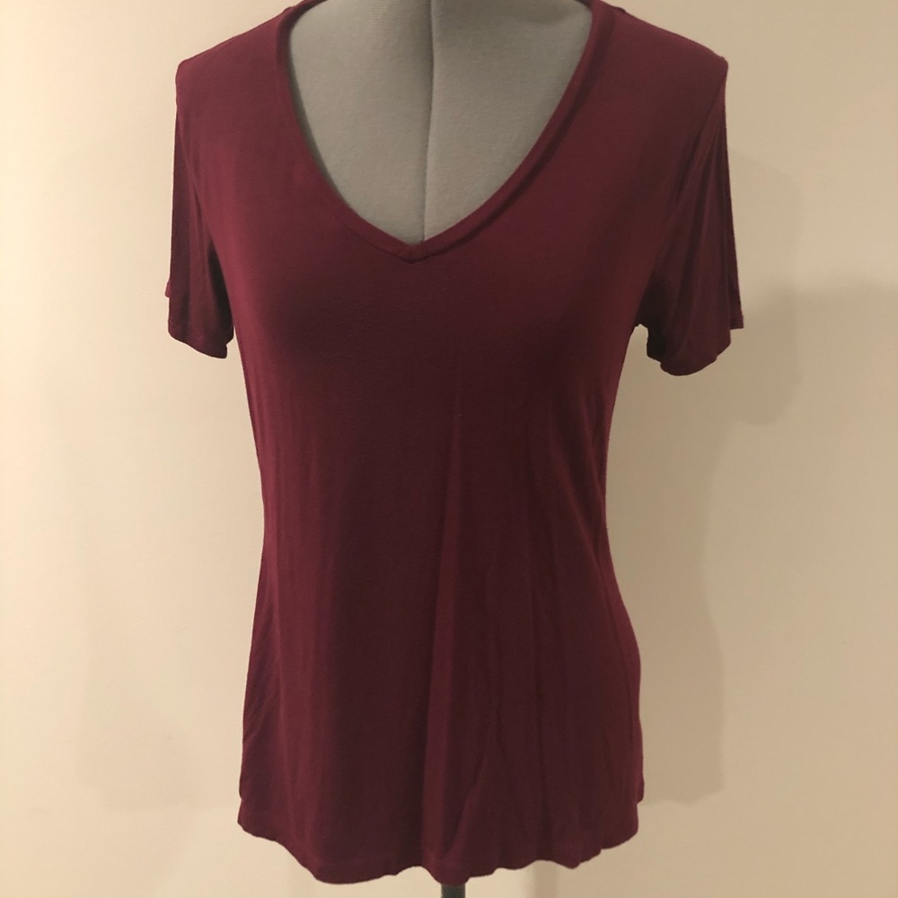 Set of 3 solid colored V neck shirts.